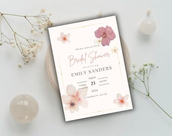 Può includere: Un invito a una bridal shower bianco con un bordo dorato e illustrazioni floreali rosa. Il testo recita "Si prega di unirsi a noi per una Bridal Shower in onore di Emily Sanders Venerdì 23 agosto 04 PM 2024 123 Anywhere St. Any City"