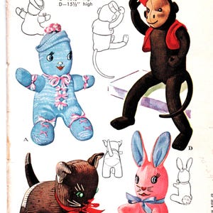 May include: Vintage McCall's pattern 1443 for stuffed sock toys. The pattern includes instructions for a blue doll, a black monkey, a brown cat, and a pink bunny. The toys range from 20.3 cm to 39.4 cm high.