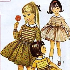 May include: Vintage Simplicity sewing pattern featuring illustrations of three girls in dresses. The dresses have a variety of designs, including striped bodices and full skirts. The pattern includes the text "Printed Pattern 50c" and the number "6147".
