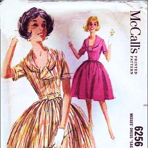 May include: A vintage sewing pattern for a dress, featuring two models wearing different styles. The pattern is McCall's 6256, size bust 36, and is described as "easy to sew".