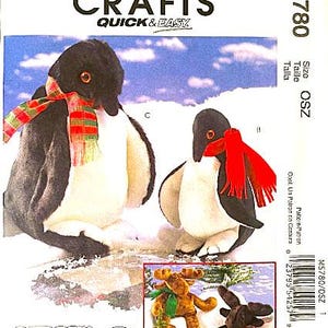 May include: McCall's Crafts pattern M5780 featuring two penguin plushies with scarves, and a moose and rabbit plushie. The penguins have black and white bodies with red and green scarves. The pattern includes the text "CAROL'S ZOO".