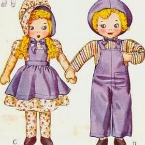 May include: Two vintage fabric dolls, a girl and a boy, holding hands. The girl doll wears a purple dress, floral patterned leggings, and a bonnet. The boy doll wears purple overalls, a striped shirt, and a cap. Both dolls have blonde hair and rosy cheeks.
