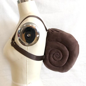 Small Brown Snail Shell Backpack in dark brown faux suede