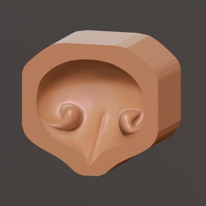 May include: A brown, 3D printed mold for making a pair of ears. The mold is shaped like a pair of ears with a small, raised ridge in the center.