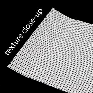 May include: Close-up of a white fabric with a fine, evenly spaced dot pattern. The fabric has a smooth, slightly textured surface.