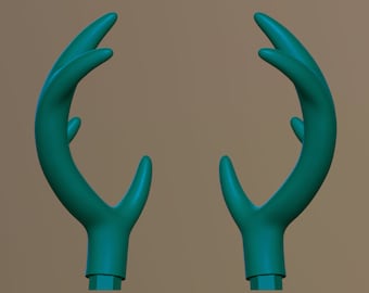 May include: A pair of teal green deer antlers, made of plastic, with a smooth, rounded surface.