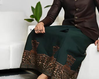May include: A dark green sarong with a brown decorative border featuring a repeating pattern. The sarong is paired with a brown jacket. The text "Tronic Craft" is visible on the image.