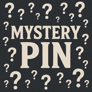 May include: A dark gray background with white question marks scattered around the words "MYSTERY PIN" in a bold, off-white font. The design suggests a surprise or unknown item.
