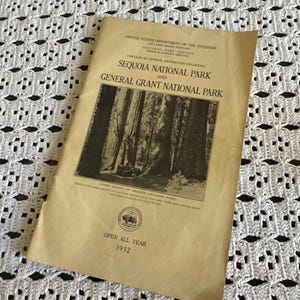 May include: A vintage 1932 tan paper pamphlet titled Circular of General Information Regarding Sequoia National Park and General Grant National Park, featuring a black and white photograph of large trees and the Department of the Interior seal.