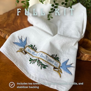 May include: A white tea towel with blue birds and green leaves embroidered on it. The embroidery reads "Now think I don't want to". The text "FULL KIT" is in the top left corner of the image. The text "Includes tea towel, design, hoop, thread, needle, and stabilizer backing" is in the bottom left corner of the image.
