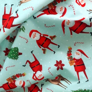 Skinny Santa Claus Holiday Sky CD8978 Cotton Fabric by Timeless Treasures