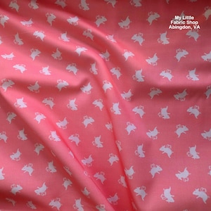 May include: Pink fabric with a repeating pattern of white pig illustrations. The fabric is slightly wrinkled, with the text "My Little Fabric Shop Abingdon, VA" in the upper right corner.