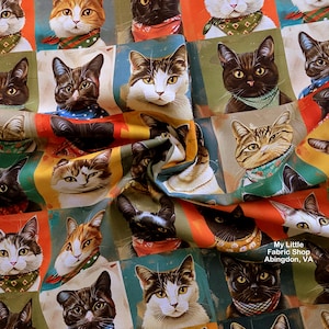 May include: A fabric featuring a repeating pattern of various cat portraits, each wearing a colorful patterned bandana. The cats are depicted in shades of black, brown, white, and orange against orange, green, and blue backgrounds. Text reads My Little Fabric Shop Abingdon, VA.