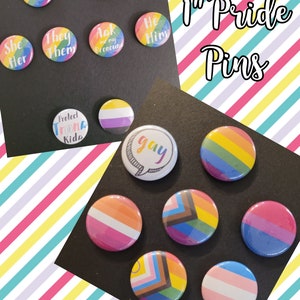 May include: A collection of 1 inch pride pins with various designs, including rainbow, transgender, non-binary, and gay pride flags. The text "1" Pride Pins" is visible in the image.