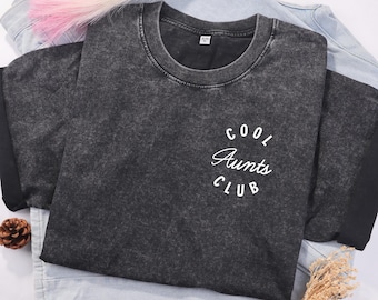 May include: A black t-shirt with a white graphic that says "Cool Aunts Club".