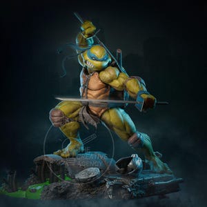 May include: A detailed statue of Leonardo, a Teenage Mutant Ninja Turtle, in a dynamic fighting pose. The figure is predominantly green and tan, with a blue mask and two katanas. The statue is on a rocky base with a dark, atmospheric background.