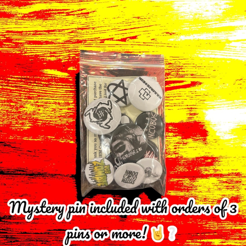 May include: A clear plastic bag filled with various round pins. The pins feature black and white graphics, including band logos and symbols. Text on the image reads "Mystery pin included with orders of 3 pins or more!"