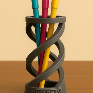 May include: A gray, 3D printed pen holder shaped like a double helix. The holder has the word "DARWIN" printed on the base. Three pens are in the holder: one blue, one pink, and one yellow.