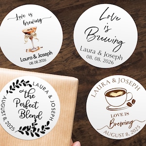 May include: Four white circular stickers with text and illustrations. Two stickers say "Love is Brewing" with a cocktail and a coffee cup. The other two say "The Perfect Blend". Names and dates are included.