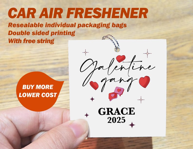 May include: A white car air freshener with the text "Galentine gang" and "GRACE 2025" in black script. The design includes red hearts and stars. The freshener has a string for hanging.