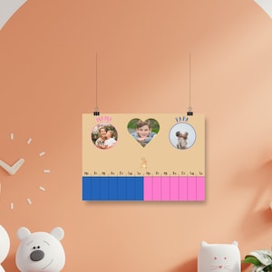 May include: A beige poster with a blue and pink calendar grid. The poster has three circular images of a family with the words "Mama" and "Papa" above the images. The poster is hanging on a peach wall.