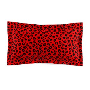 May include: A rectangular pillowcase with a red background and a black leopard print pattern. The pillowcase has a sewn border and is designed for a standard-sized pillow. The fabric appears to be soft and comfortable.