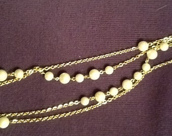 Four feet of faux pearls and golden chain necklace