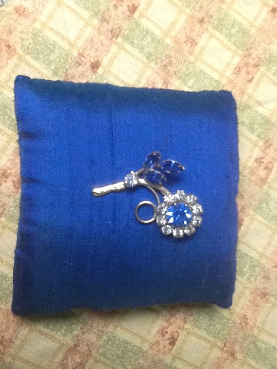 Blue rhinestone silver tone brooch