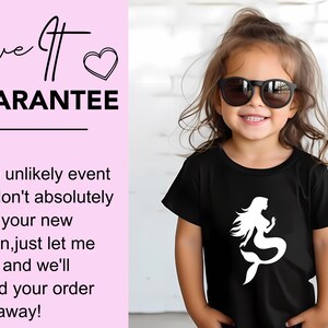 May include: A young child wearing sunglasses and a black t-shirt with a white mermaid graphic. The text "Love It Guarantee" is visible in the image, along with a guarantee of a refund if the design is not loved.