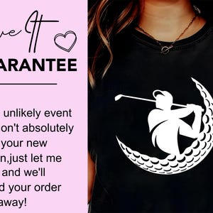 May include: A black t-shirt with a white silhouette of a golfer swinging a club, with the golf ball forming a crescent moon shape. The text "Love It Guarantee" is on a pink background with a heart.
