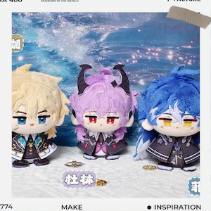 May include: Three plush dolls with anime-style features. The dolls have blonde, purple, and blue hair, each with unique outfits. The purple doll has horns. The dolls are on a background with a blue and white design. The image includes the word "MAKE".