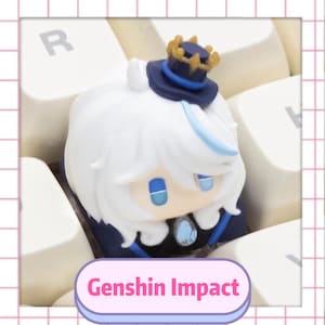 May include: A white and blue figurine of a character with a crown and hat, resting on a keyboard. The figurine has blue eyes and a blue gem. The text "Genshin Impact" is displayed on a pink and purple banner.
