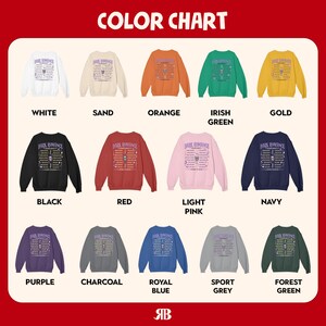 May include: A color chart displays various crewneck sweatshirts in multiple colors, including white, black, red, and navy. Each sweatshirt features the text "DARK ROMANCE" and a graphic design. The chart includes colors like orange, green, and gold.