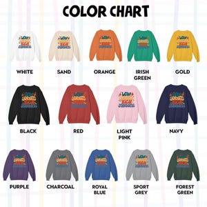 May include: Color chart showing 14 different colors of sweatshirts with the text "Low Squats High Standards" printed on the back. The colors are white, sand, orange, Irish green, gold, black, red, light pink, navy, purple, charcoal, royal blue, sport grey, and forest green.