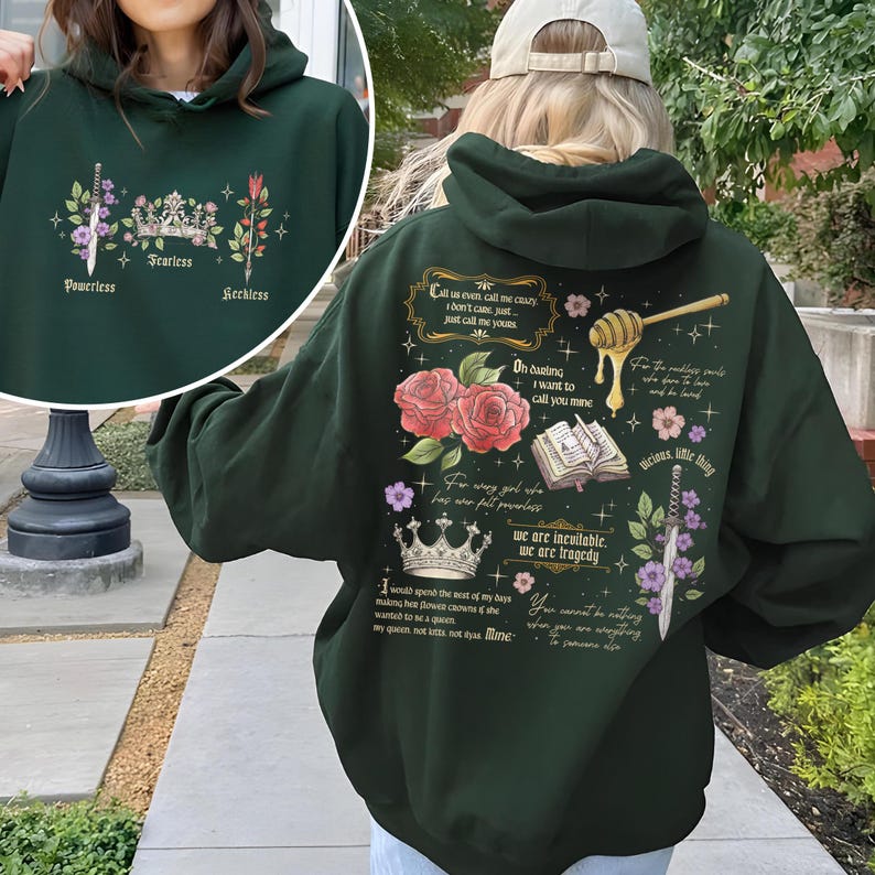 May include: Dark green hooded sweatshirt with a floral and text design. The text includes quotes like "Call us even call me crazy, I don't care, just call me yours" and "We are inevitable, we are tragedy".