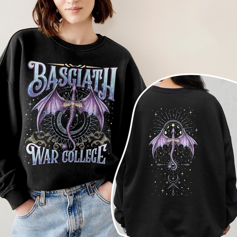 May include: Black sweatshirt featuring a purple dragon design with the text "BASCIATH WAR COLLEGE". The dragon has outstretched wings and is centered on a celestial background. The back of the sweatshirt also features a dragon design.