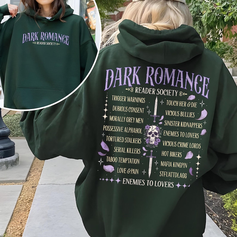 May include: Dark green hoodie with the text "DARK ROMANCE READER SOCIETY" in lavender. The back of the hoodie features a list of dark romance tropes and a skull graphic. A casual, comfortable garment.