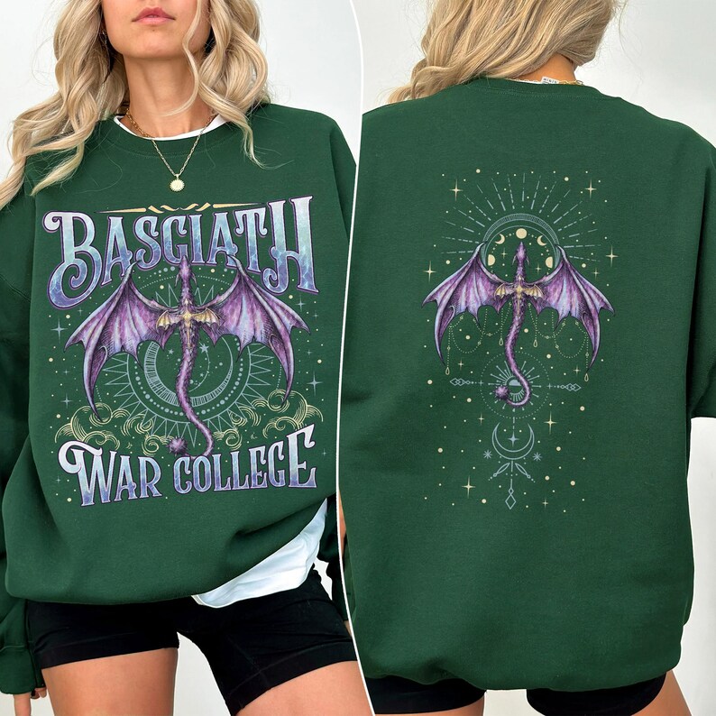 May include: Dark green sweatshirt with a front and back design. The front features the text "BASCIATH" above a purple dragon illustration, and "WAR COLLEGE" below. The back has a similar dragon design. The sweatshirt has a crew neck.