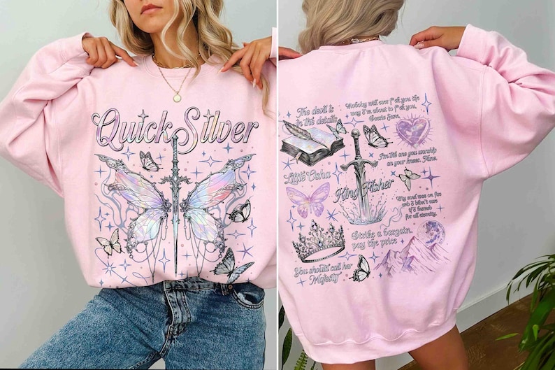 Peut inclure: Sweat-shirt rose avec un imprim&eacute; graphique d'un papillon, d'une &eacute;p&eacute;e et d'une couronne. Le texte "Quick Silver" est imprim&eacute; sur le devant du sweat-shirt. Le texte "King Fisher" est imprim&eacute; sur le dos du sweat-shirt.