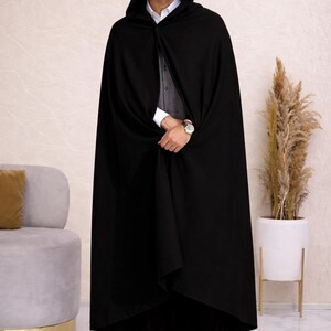 May include: A set of three ceramic mugs with a speckled, matte finish. The mugs are in shades of cream, light gray, and dark gray. Each mug has a simple, minimalist design, perfect for coffee or tea.