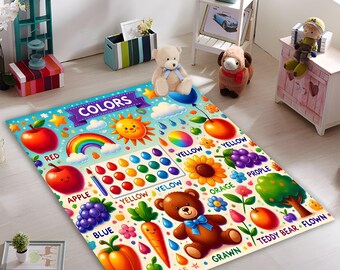 May include: A colorful play mat with a rainbow, clouds, and various objects like an apple, grapes, a teddy bear, and a carrot. The mat features the word "COLORS" and the names of different colors in English.