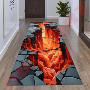 May include: A gray and orange rug with a 3D design of a cracked earth opening to reveal a glowing orange lava flow.