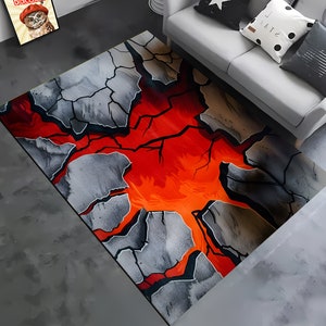 Puede incluir: Una alfombra gris y negra con un diseño de superficie agrietada. Las grietas revelan un patrón de lava naranja y rojo brillante.