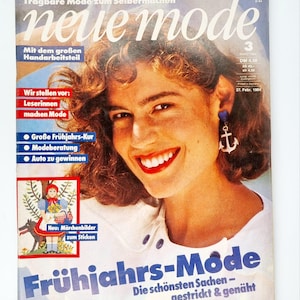 May include: A magazine cover featuring a woman with curly brown hair and a white shirt. The magazine is titled "neue mode" and the cover text says "Frühjahrs-Mode" and "Die schönsten Sachen - gestrickt & genäht".