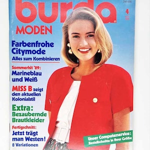 May include: A vintage Burda Moden magazine cover with a woman in a red jacket. The cover includes German text such as "Farbenfrohe Citymode" and "Bezaubernde Brautkleider." The magazine is dated April 1989.