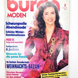 May include: A vintage magazine cover with a woman wearing a pink paisley blazer and a gold brooch. The magazine is "Burda Moden" with German text. The cover also displays the date November 1988.