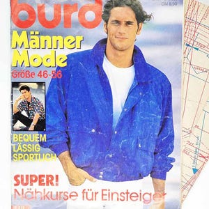 May include: A magazine cover with a man wearing a blue jacket and white shirt. The magazine title is "Burda Männer Mode" with the size range "Größe 46-56". Text includes "BEQUEM LÄSSIG SPORTLICH" and "SUPER! Nähkurse für Einsteiger".