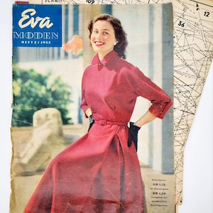 May include: A vintage magazine cover featuring a woman in a red dress. The magazine is titled "Eva MODEN" and the issue number is "HEFT 2/1953".
