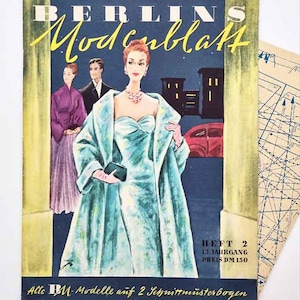 May include: A vintage magazine cover, "BERLINS Modenblatt", with a teal-clad woman as the focal point. The cover has a dark blue backdrop, yellow lettering, and illustrations. Text includes: HEFT 2, 13. JAHRGANG, PREIS DM 150. Includes pattern sheets.