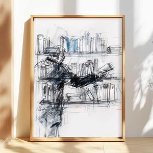 May include: A framed art print featuring a sketch of a person browsing bookshelves. The artwork is primarily black and white with blue accents, set in a light wooden frame. The sketch style gives the print a unique, artistic feel, suitable for home decor.